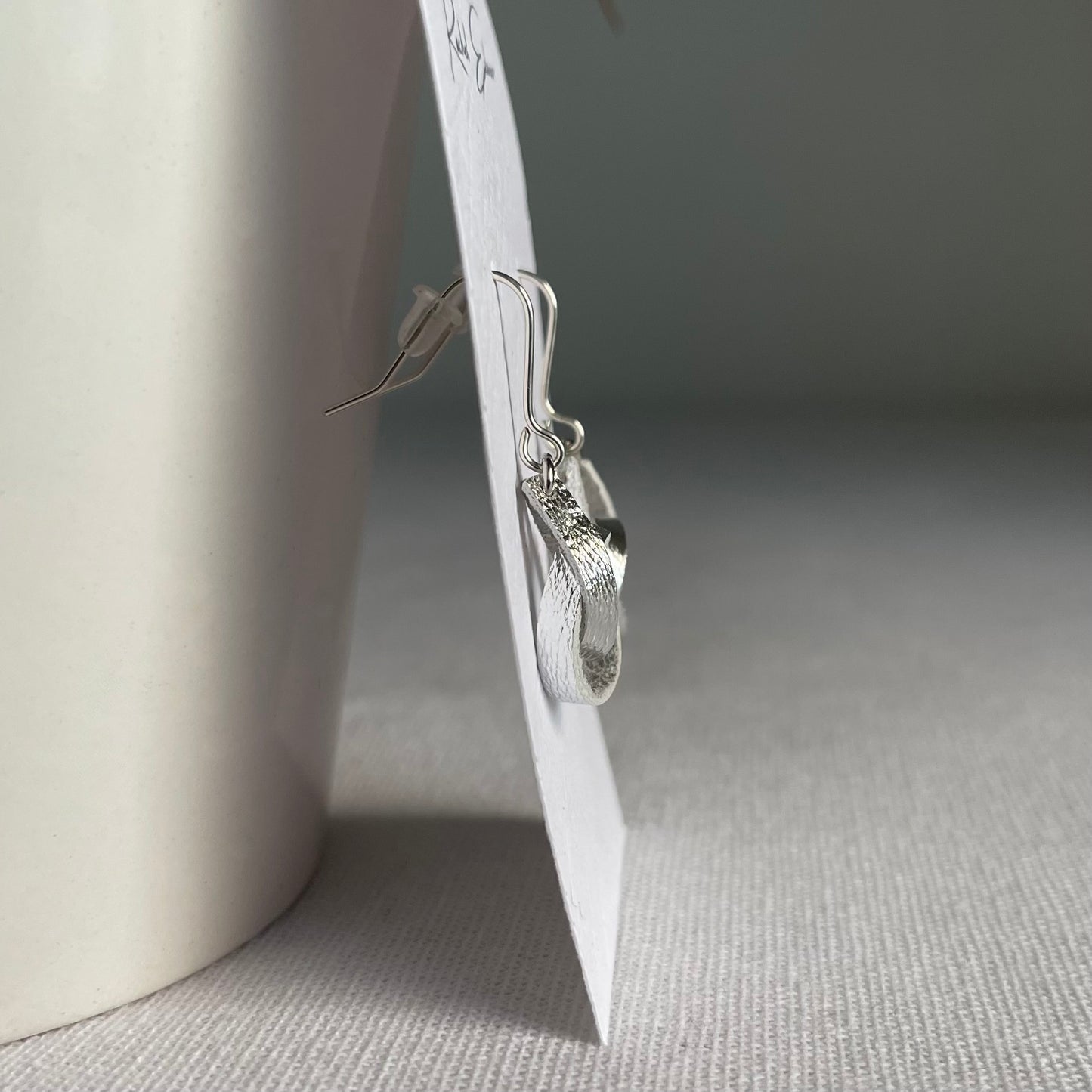 Metallic Silver Knotted Leather Drop Earrings