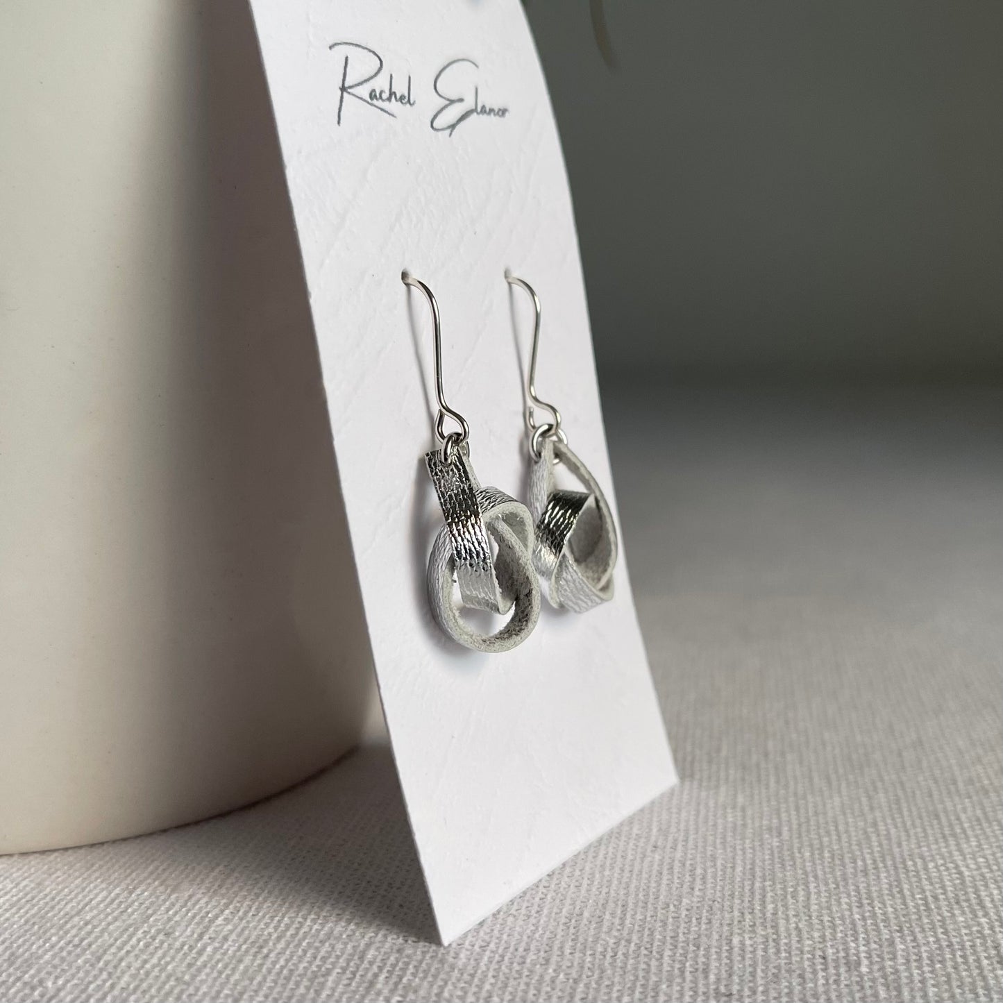 Metallic Silver Knotted Leather Drop Earrings