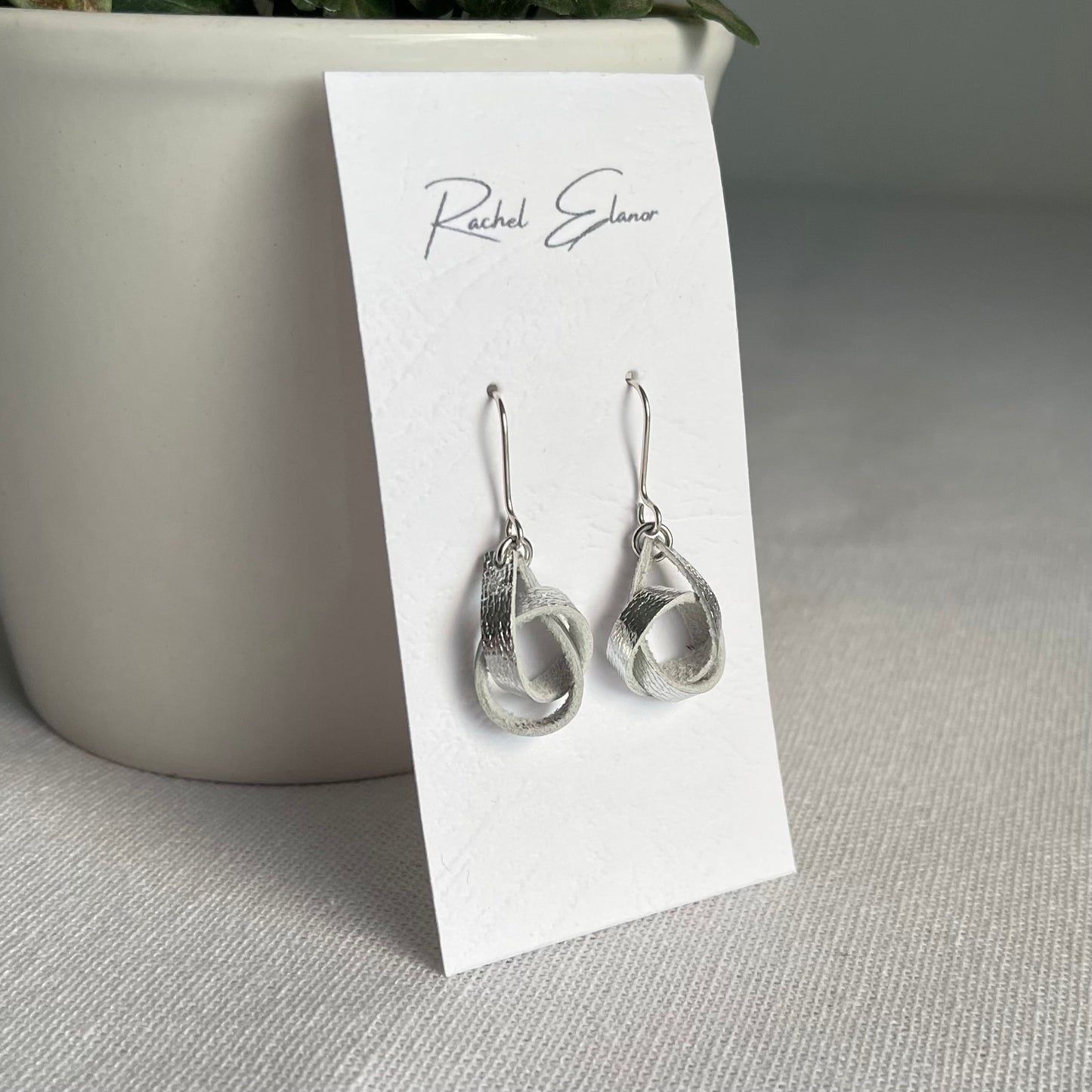 Metallic Silver Knotted Leather Drop Earrings