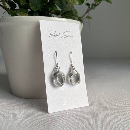 Metallic Silver Knotted Leather Drop Earrings